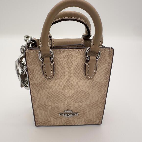 Coach Handbags - COACH NWT North/South Mini Tote Bag Charm In Signature Canvas